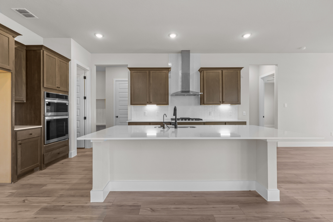 A kitchen with a white countertop.