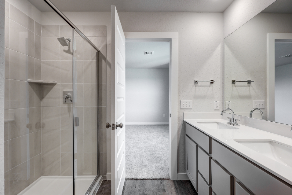 A bathroom with a glass shower.