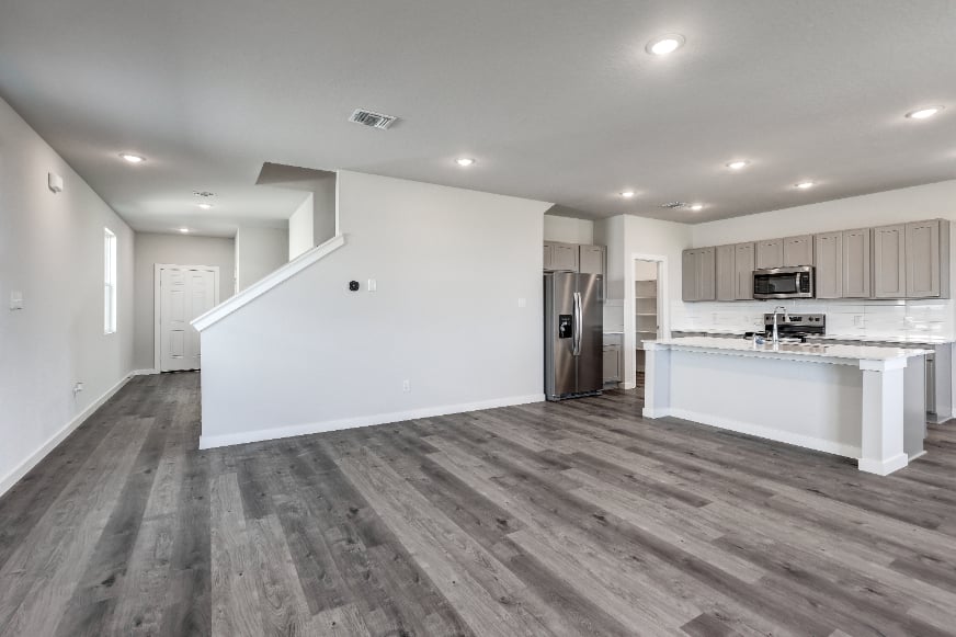 A kitchen with wooden floors.