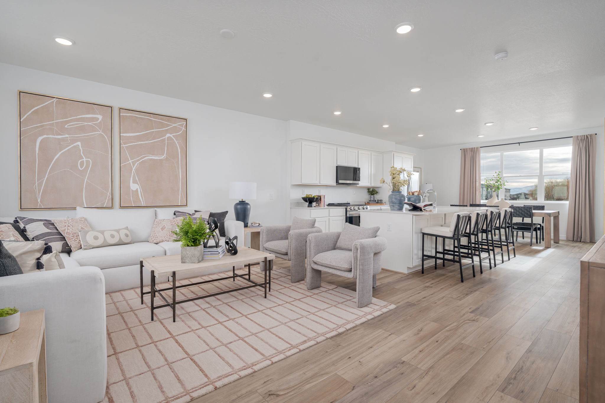 A large living room with a wood floor.