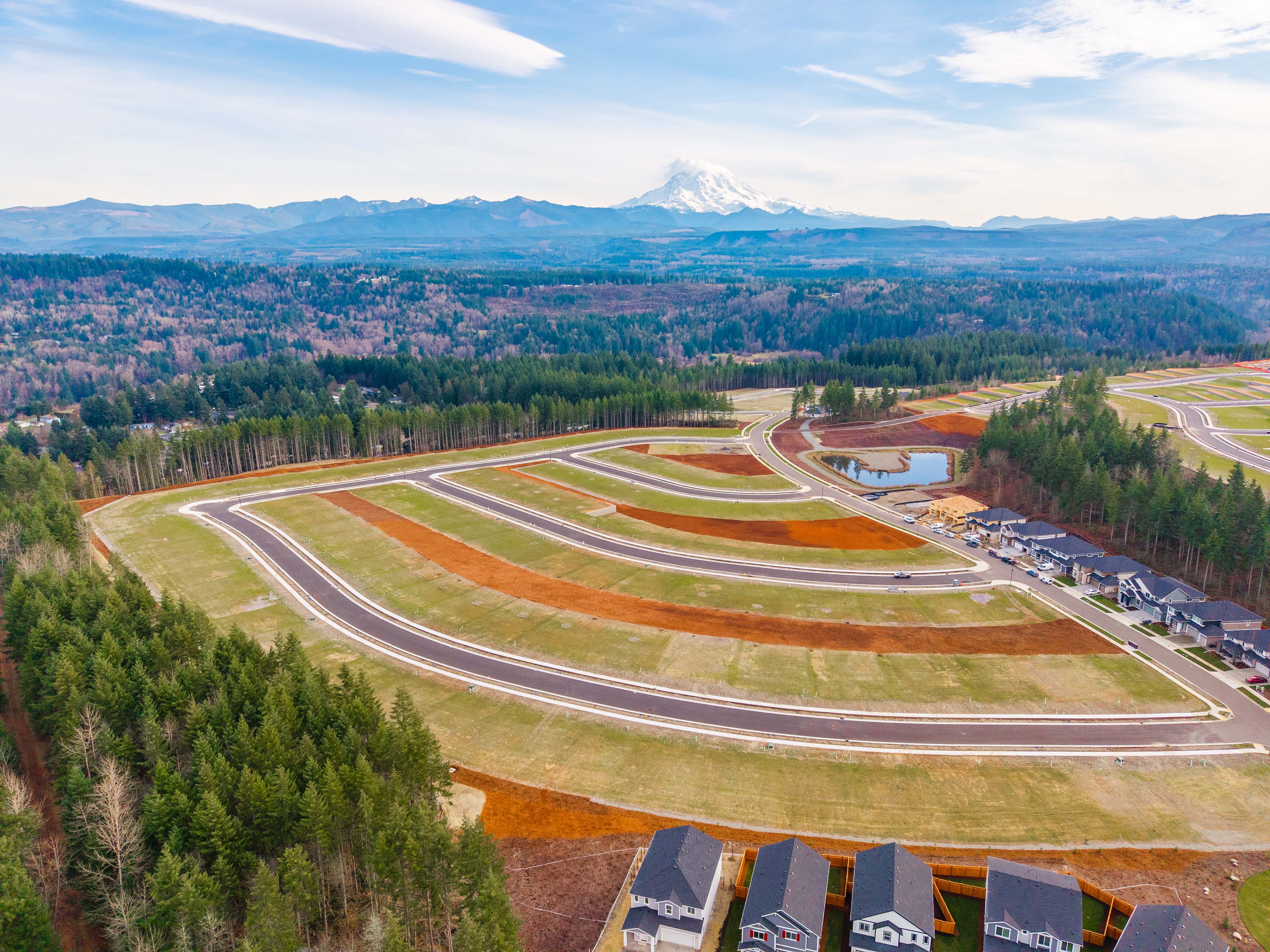 A landscape with a mountain in the background.