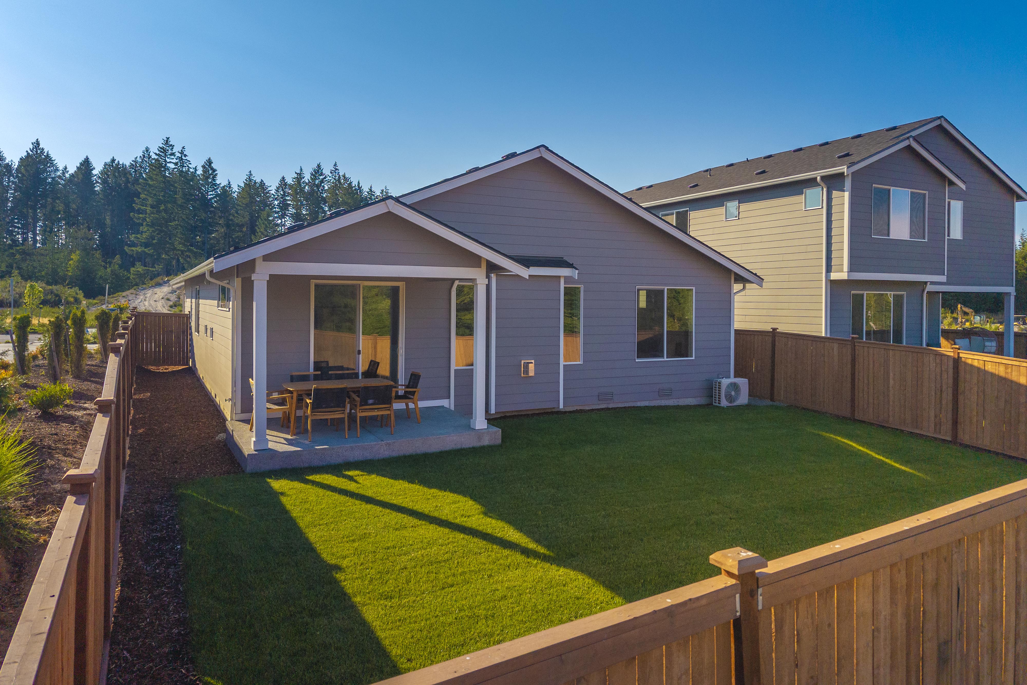 A house with a yard and a fence.