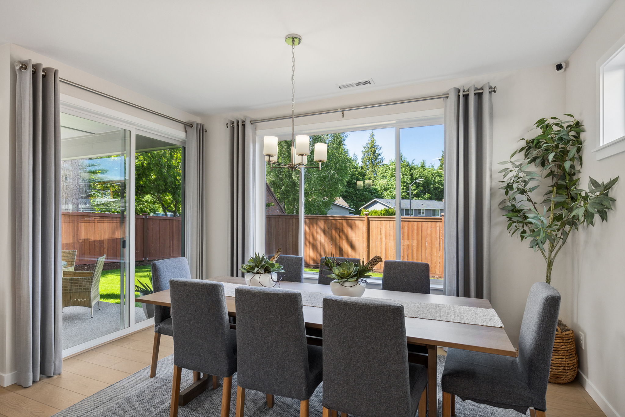 A dining room with a large glass door.