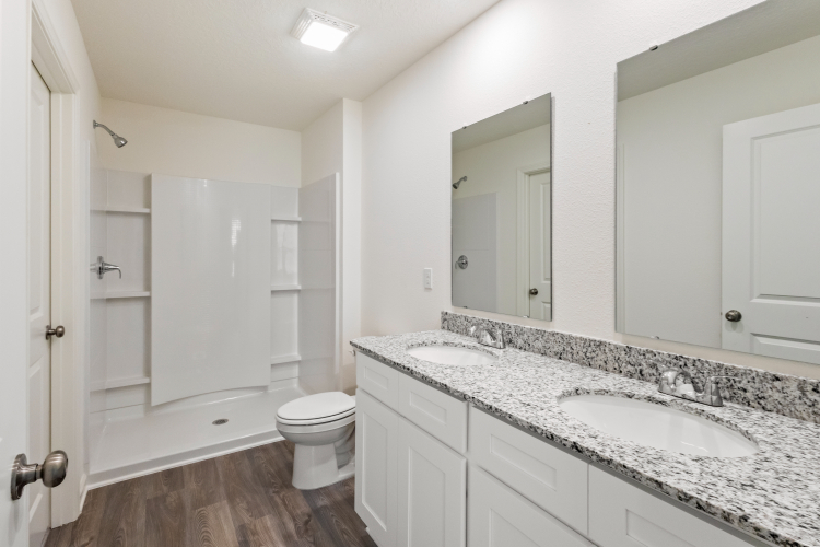 A bathroom with a marble countertop.