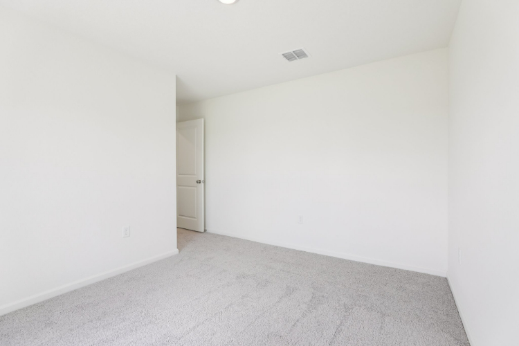 A hallway with white walls.