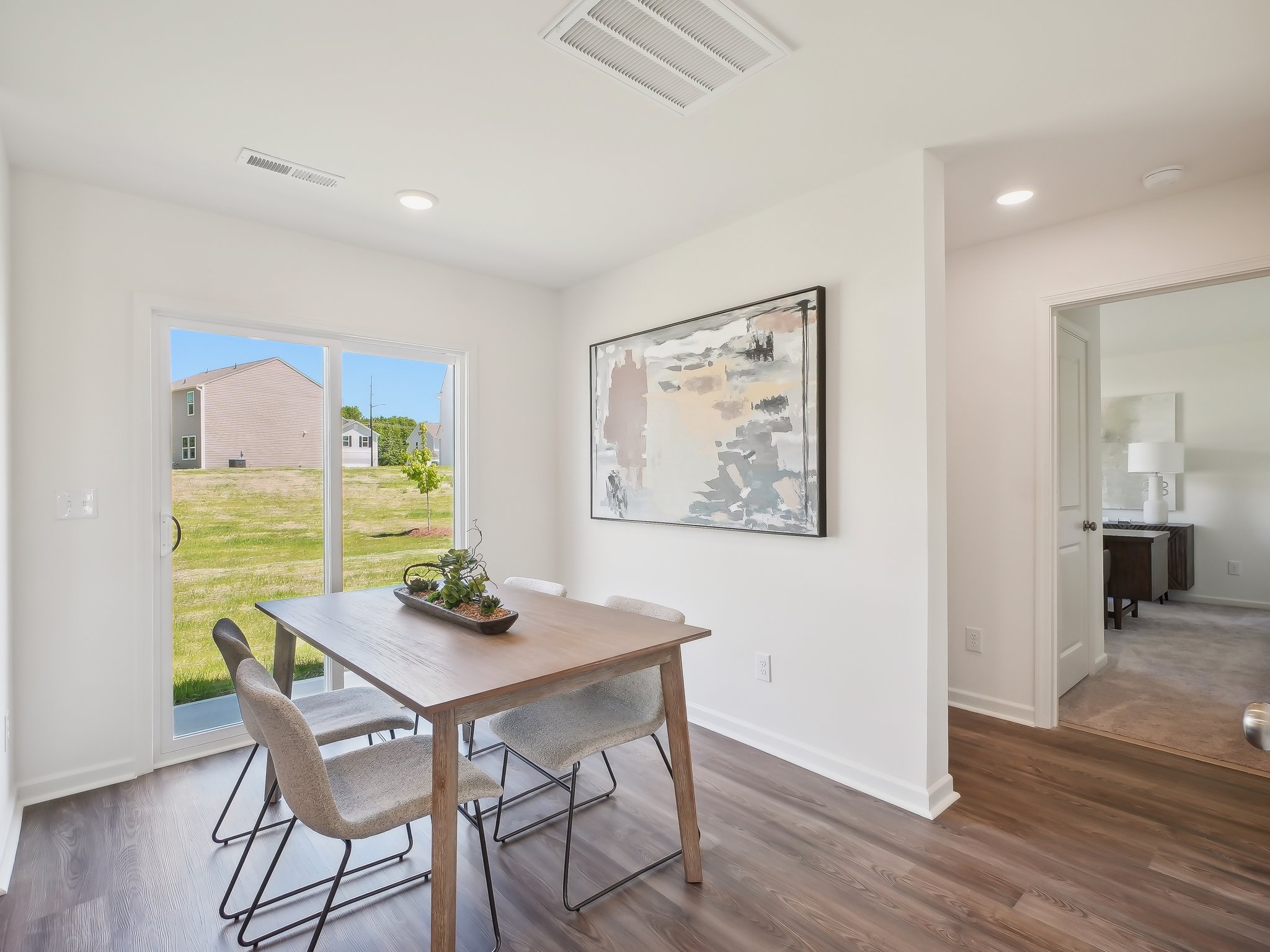 A dining room table with chairs.
