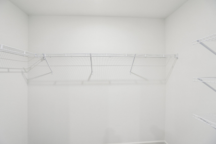 A white staircase in a room.