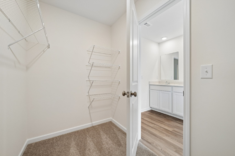 A white bathroom with a white door.