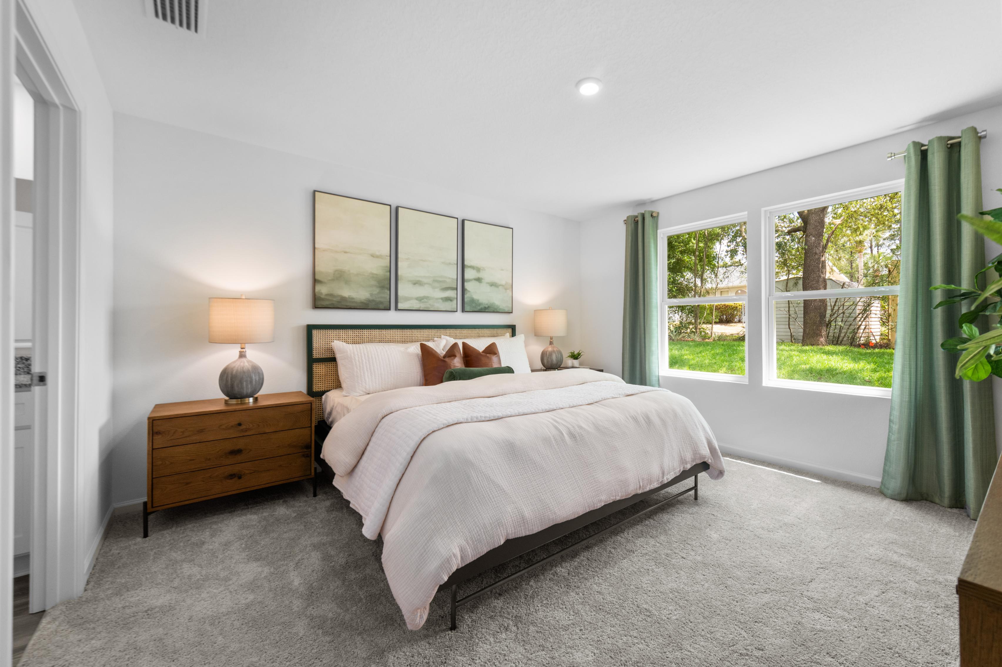 A bedroom with a large bed.