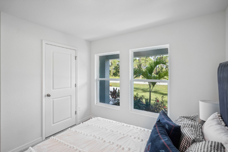 A room with a couch and a window.