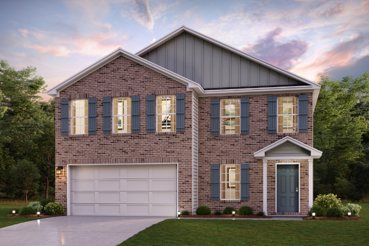 A brick house with a garage.