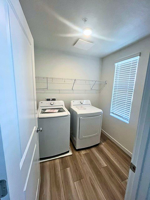 A small kitchen with a washer and dryer.