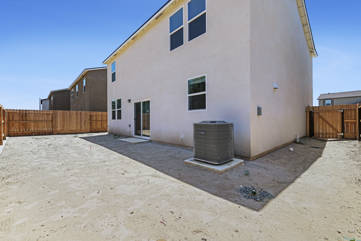 A white building with a fence.