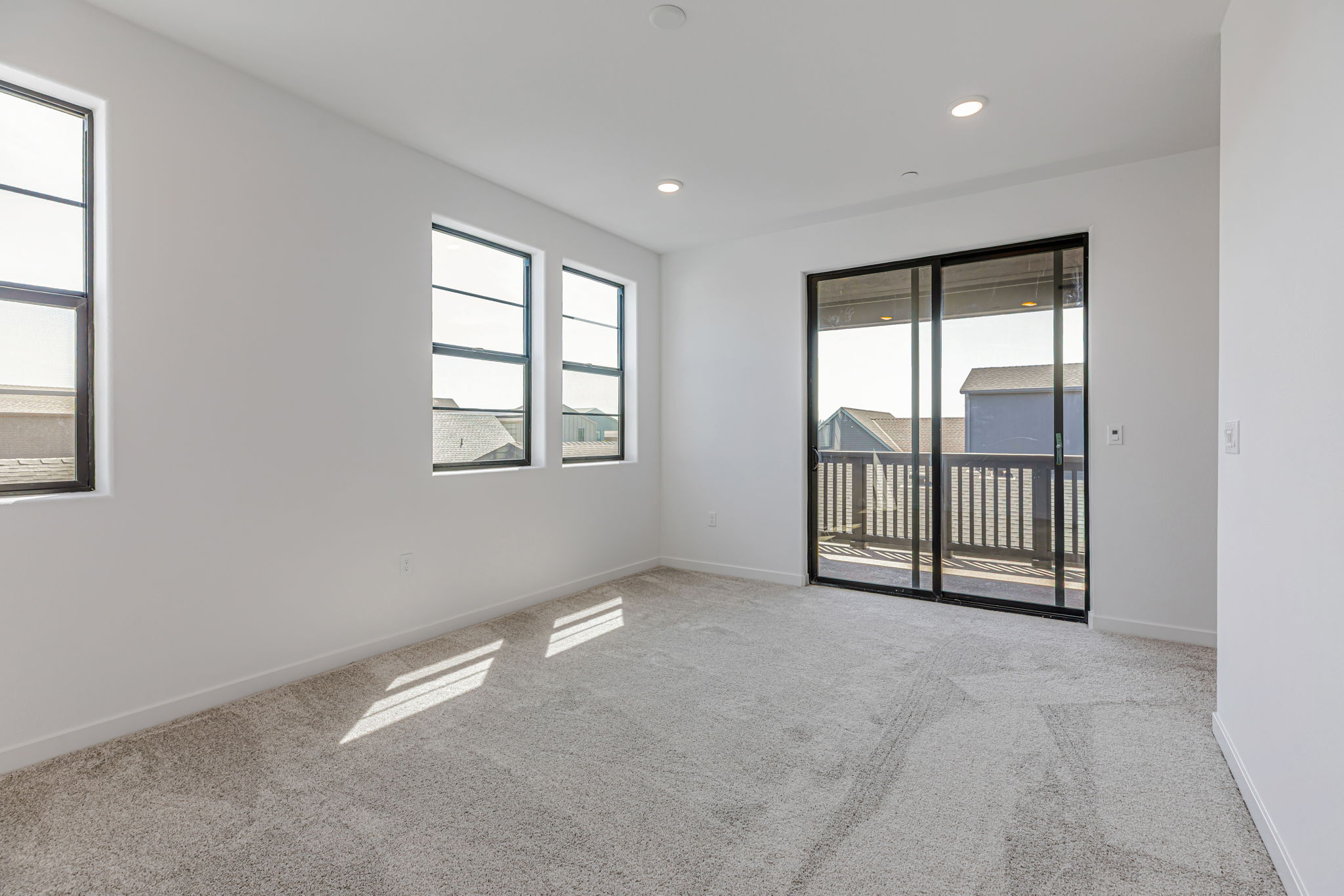 A room with a door and windows.